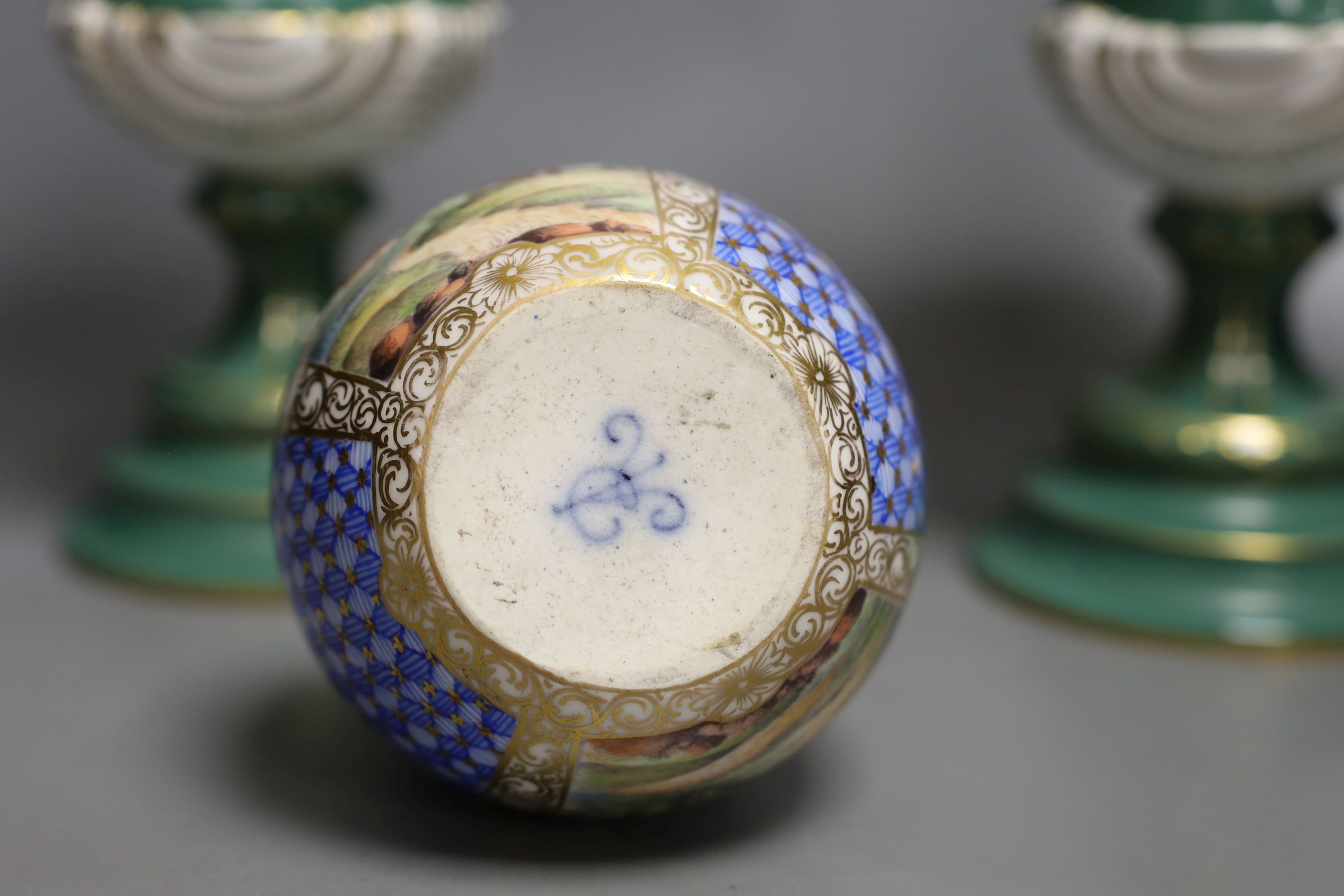 A pair of early 20th century Dresden vases painted with landscapes on an avocado green ground, 24cm high together with a German bottle vase and cover painted with four landscape panels separated by blue and white panels